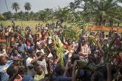 Lucien Ambunga, a Catholic priest and the Pastor of Itipo returns home to his parishioners in Itipo village after surviving Ebola.